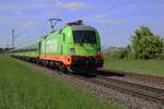 Flixtrain 242.503 hauls a fast train through Kaarst Broicherheide on 8 May 2025.