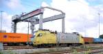 182 506-6 Dispolok and container crane at Container Terminal Ulm, October 14th, 2009.