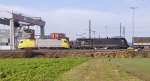 182 510-8 and 182 528-0 passing Ulm container terminal, November 21st, 2009.
