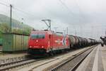 On 8 June 2009 HGK 185 606 hauls an oil train through Treuchtlingen toward Ingolstadt.
