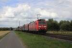 Steel train with DBC 185 149 passes through Kaarst Broicherseite and gets photographed on 23 July 2025.