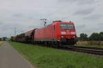 DBC 185 009 hauls a mixed freight near Kaarst Broicherseite on a grey 8 August 2025.