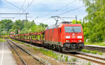 DB-Cargo 185 346 is pulling an empty car transport train through Aßling station in Upper Bavaria on the Munich-Rosenheim route.