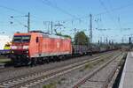 Ratherbleached DBC 185 012 hauls a steel train through Neuwied on 30 April 2026. The use of environment friendly paints sadly has lead to the fastbleaching of DB locos because the paints are less capable to withstand bad weather conditions.
