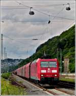 185 112-0 is hauling a goods train through the station Koblenz-Ehrenbreitstein on June 24th, 2011.