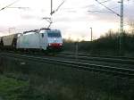Class 186 of the private rail company  ITL  is pulling a train with cereal wagons past Brunswick.