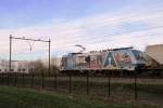 On 16 December 2013 RTB 186 110 in advertising livery passes Wijchen with a cereals train bound for Oss.