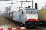 RailPool/ERS/BLS 186 103 speeds through Tilburg on 4 April 2014 and almost takes the photographer by surprise.