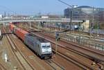 Metrans 386 004 passes at Dresden under the bridge at the Budapester Strasse on 8 April 2018. 