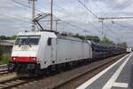 Macquarie 186 137 hauls a train of automotives into Bad Bentheim on 15 July 2019.