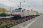 On 14 November 2019 RailPool 186 102 hauls a container train through Emmerich toward Kijfhoek.