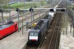 MRCE 189 288 with dead sister in tow and an inter modal train passes Breda (NL) on 4 April 2014.