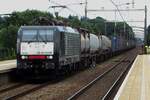MRCE 189 097 hauling an intermodal train thunders through Tilburg-Reeshof on 7 July 2021.