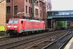 On 1 June 2012 DB 189 012 hauls a partially empty container train through Hamburg-Harburg.