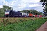 MRCE 189 093 hauls an intermodal train through Tilburg Oude Warande on 30 July 2019.