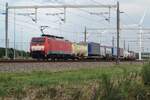 On 28 July 2022 DB cargo 189 082 hauls an intermodal train through Valburg.