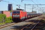 On 15 May 2019 a block train of steel coils gets hauled by 189 066, passing Nijmegen-Dukenburg toward Utrecht.
