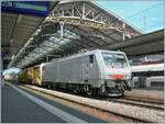The akiem 64 F4 082 (91 80 189 982-2 D-AKIIEM) is waiting in Lausanne with a track-laying machine for its imminent onward journey toward Vevey.