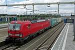 DB Cargo 193 332 hauls an intermodal through Lage zwaluwe on 28 June 2020.