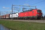 DBC 193 329 hauls a coal train through Valburg CUP on 15 February 2023.