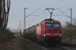 DB Cargo 193 338 hauls a tank train through Kaarst on 21 February 2025 and almost gets missed photographically.