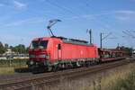 DBC 193 325 hauls an empty car carrying train through Venlo VIerpaardjes into Germany on 7 August 2025.