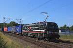 SBBCI 193 856 hauls a container train into Venlo on 7 August 2025, passing a now closed railway crossing.