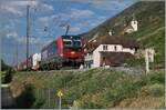 The Locomotive 193 074, leased by SBB Cargo, fills much of the frame as it hauls a long freight train near Ligerz at kilometer 94.5. The train is traveling in the direction of Biel/Bienne. Despite the train’s dominance in the scene, there was still room for the well-known church of Ligerz to be included in the shot. August 24, 2026