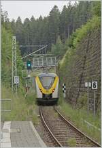 The DB 1440 676 is leaving the Seebrugg Station in the Black Forest.