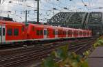 Two coupled electric multiple units 425094-0 and 425092-4,of the DB Regio has left the Cologne Central Station on 07.08.2011 and are now driving them across the Hohenzollern Bridge.