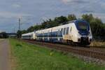 National Express 9 442 160/660 passes Kaarst-Broicherheide on 23 July 2025.