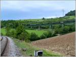 The heritage train of the Wutachtalbahn, popularly known as the Sauschwnzlebahn (pigtail line), is running on the Biesenbach viaduct near Epfenhofen on August 19th, 2006.