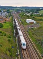 . A ICE 3 is running on the high speed track between the station Montabaur and the tunnel Himmelberg near Montabaur on May 25th, 2014.