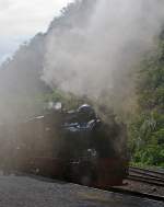 Steam Day on Brohltalbahn - In the Smoke - The guest lok 99 6101  Pfiffi  of the Harz Narrow Gauge Railways (Harzer Schmalspurbahnen) on 02.09.2012 at the Narrow Gauge Railway station Bohl.