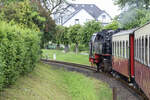 The Molli (German: Mecklenburgische Bäderbahn) is a narrow-gauge steam-powered railway in Mecklenburg, Germany, running on 900 mm gauge track. It operates between Bad Doberan, Heiligendamm and Kühlungsborn West over a total distance of 15.4 km with a running time of 40 minutes. Date: /th June 2025.