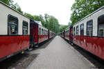 Two trains on the Mecklenburgische Bäderbahn pass each other at Heiligendamm station on the Baltic Sea coast.