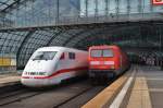 On the left site 401 051-8  Lneburg  as ICE874 from Karlsruhe main station to Berlin Ostbahnhof and on the right site 114 028 with a local train from Frankfurt(Oder) to Magdeburg main station. Berlin main station, 25.2.2012.