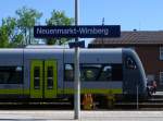 Here you can see the sign  Neuenmarkt-Wirsberg . 
In the back you can see a lokal train.

Neuenmarkt-Wirsberg, May 19th 2013.