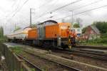 Bocholter Eisenbahn 295 057 with two tank wagons and crew is shunting at Emmerich on 14 April 2014.