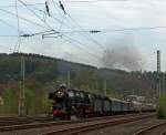 The three-cylinder express steam locomotive 01 1066 of the UEF, ex DB 012 066-7, pulls the second special train of the Eifelbahn, on the way back from Gießen over Siegen and over the track of the Sieg (KBS 460) in the direction of Cologne. Here on 28.04.2011 in Betzdorf/Sieg.