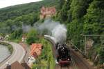 The steam locomotive 01 202 with an extra train drives under the Castle of Zwingenberg to Heilbronn. On the left you can see the Neckar River.