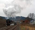 The Betzdorfer 52 8134-0 on 27.11.2011 with Santa Claus Train, between Betzdorf/Sieg and Wrgendorf. Here it comes from Betzdorf and passes through the station Herdorf.