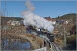 With a magnificent plume of steam, the UEF 58 311 leaves Schluchsee with its steam train, awkwardly the steam plume exactly obscures the distinctive church of Schluchsee...