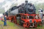  German steam loco 64 415 (owned by a Swiss preservation society) stands in bad weather in Interlaken Ost on 14 May 2010.