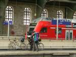 In Germany going by bike is very popular. There are many green, car free routes in each state. Using regional trains with bikes is mostly uncomplicated. In the picture a young family is waiting for a train. 07/2009