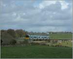 A Irish local Train on the way from Galway to Limerick by Ardrahn.