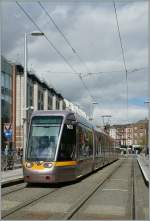 A  greenline  LUAS in Dublin by the Stephens Green.
