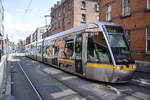 Tram LUAS Citadis 3019 in Bernburb Street of Dublin.The silver Citadis trams, manufactured in La Rochelle by French multinational Alstom, reach a top speed of 70 km/h on off-street sections, but