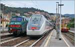 The FS Trenitalia IC 631 on the journey from Ventimiglia to Milan stopping at Finale Ligure train station.
To the left of it is the control car of the Trenord Regio 3090 from Bergamo (from 7:07) to Ventimiglia (11:48).

 September 16, 2023