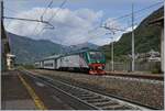 The trenord E 464 283 with a local train in Vogogna.